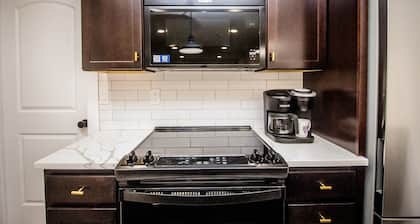 Right across from Bill Snyder Stadium w/ parking! Family size condo.