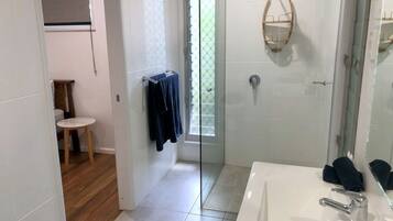Shower, hair dryer, towels, soap