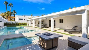 A modern outdoor pool area with a hot tub, lounge chairs, and a covered patio. - Palm Desert Home w/Pool & Spa, Walk to Ironwood Park (Palm Desert)