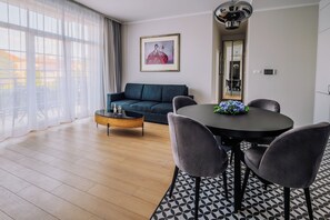 Classic Apartment | Living area | 115-cm flat-screen TV with cable channels, heated floors - Rezidencia OPERA (Turcianske Teplice)