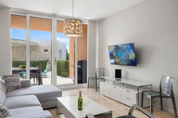 Relax in style with a flat-screen TV and comfortable seating area.