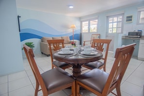 Enjoy meals with family and friends in this cozy dining area, complete with a round table and comfortable seating for four.