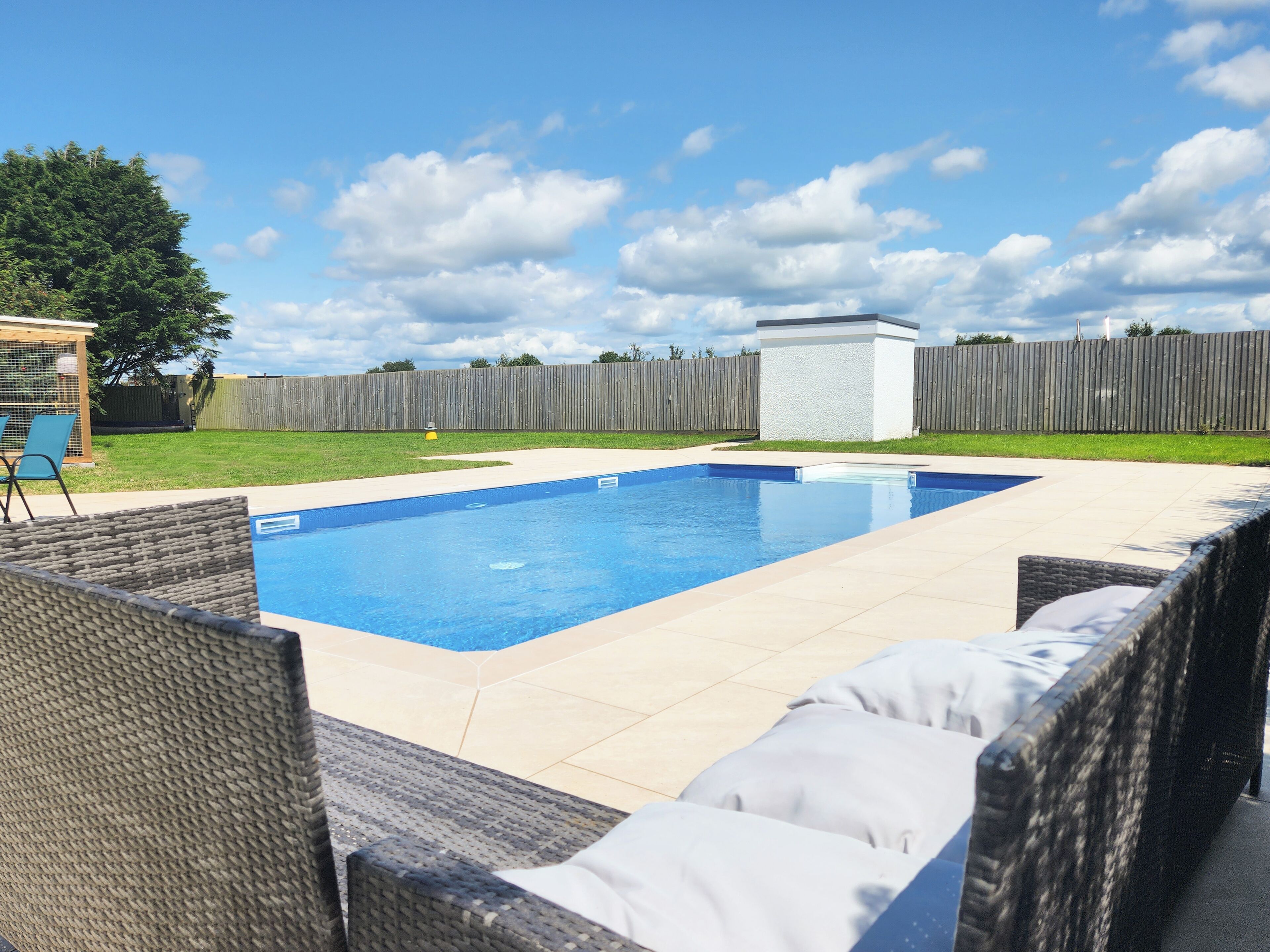 Seasonal outdoor pool, pool loungers