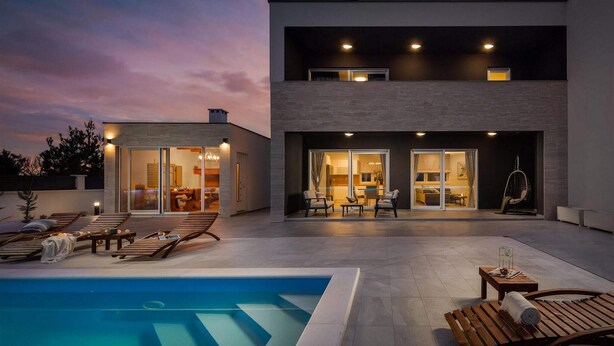 A modern two-story house with a swimming pool, outdoor seating, and a dining area. - Villa Katarina Privlaka (Privlaka)