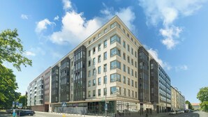A modern multi-story building with large windows and a flat roof. - MARGI Soho Apartament (Szczecin)