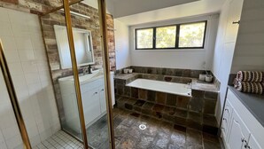 A bathroom with a shower, a sink, a window, and a towel rack. - Beautiful house, located in a quiet area of town with its own private pool (South West Rocks)