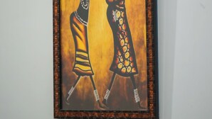 A framed artwork of two figures on a wall. - Hotel Dream villa udaipur  (Udaipur)