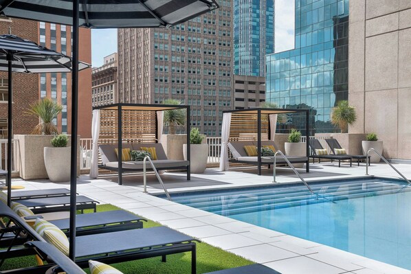 Outdoor pool, free cabanas, pool umbrellas