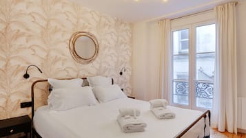 1 bedroom, desk, iron/ironing board, travel crib