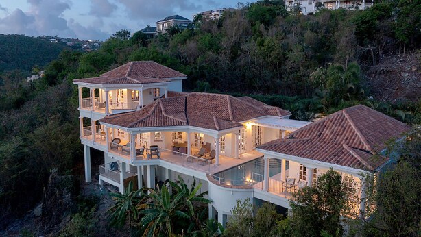 A large, multi-story house with a swimming pool, surrounded by lush greenery. - Bananaquit Villa: Amazing Views! Large Pool! Full AC! (St John)