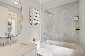 Bathtub, hair dryer, towels, soap - Charming, Elegant Historic Home (Savannah)