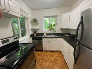 Fridge, microwave, stovetop, coffee/tea maker