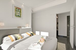 Family Apartment, Multiple Bedrooms, 2 Bathrooms (Residenza La Fontana) | 2 bedrooms, in-room safe, laptop workspace, iron/ironing board