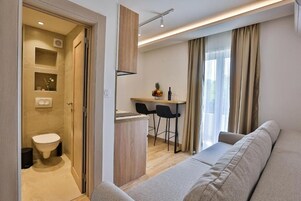 Family Apartment | Living area | 32-inch LCD TV with cable channels