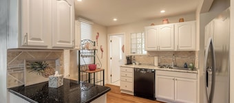 The Adorable Blue Bungalow- Pet Friendly with a fully fenced in back yard.