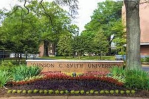 Surrounded by lush gardens, the university entrance welcomes you.