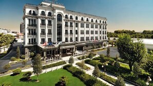 A large, historic building with a classic architectural style, featuring multiple stories and a prominent entrance. - Crowne Plaza TASHKENT by IHG (Tashkent)
