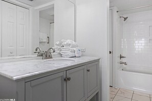Combined shower/bathtub, towels - Ocean House #2403 Condo (Gulf Shores)