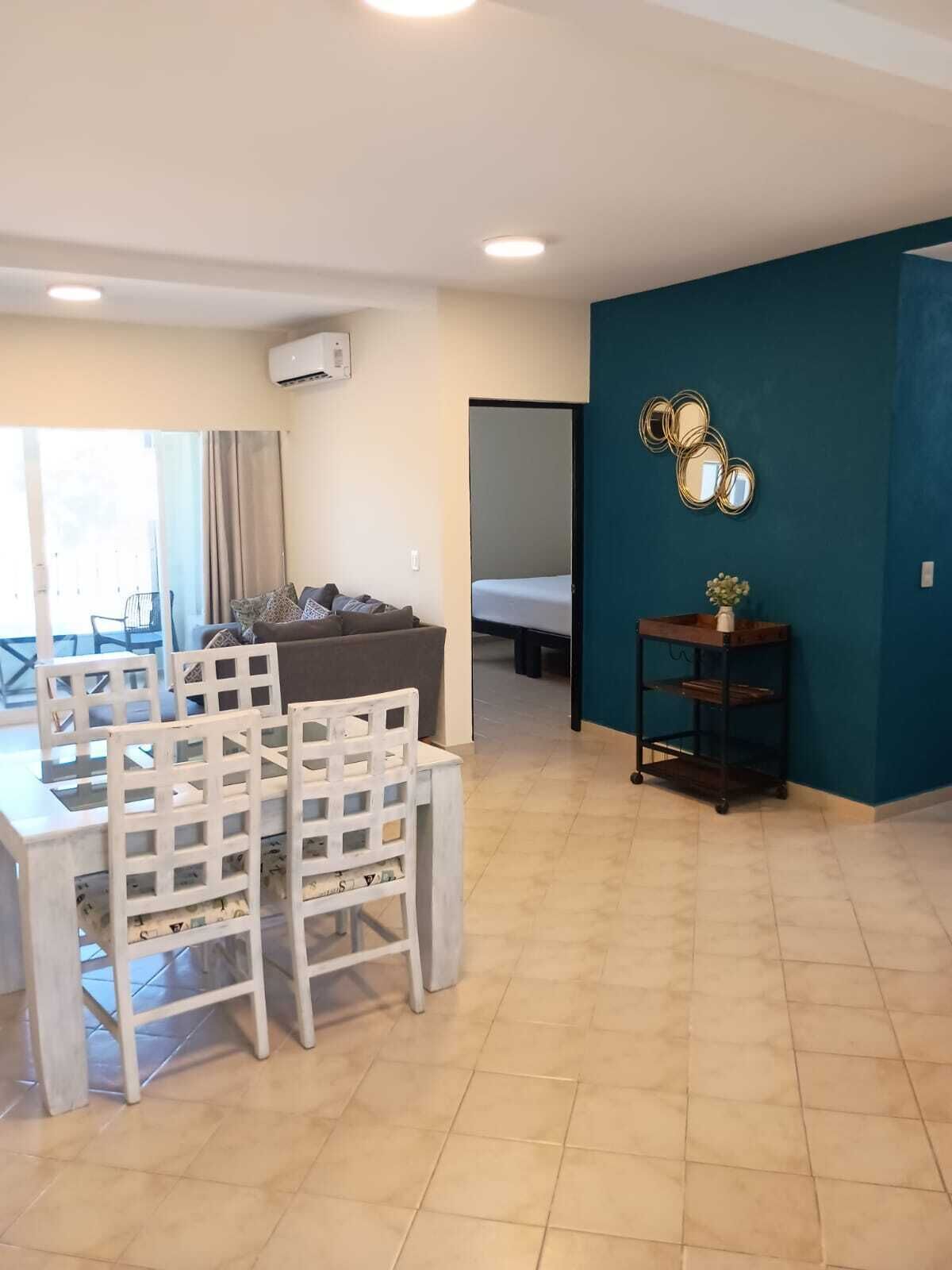 Classic Apartment | Living area | 65-inch flat-screen TV with cable channels