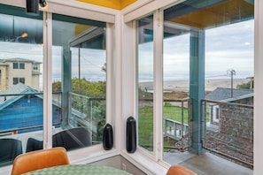 Enjoy a room with a bay window offering a view of the residential area and beach.