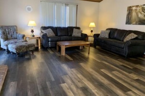 Typical Living Room, with 50" Smart TV, and Gas Fireplace.