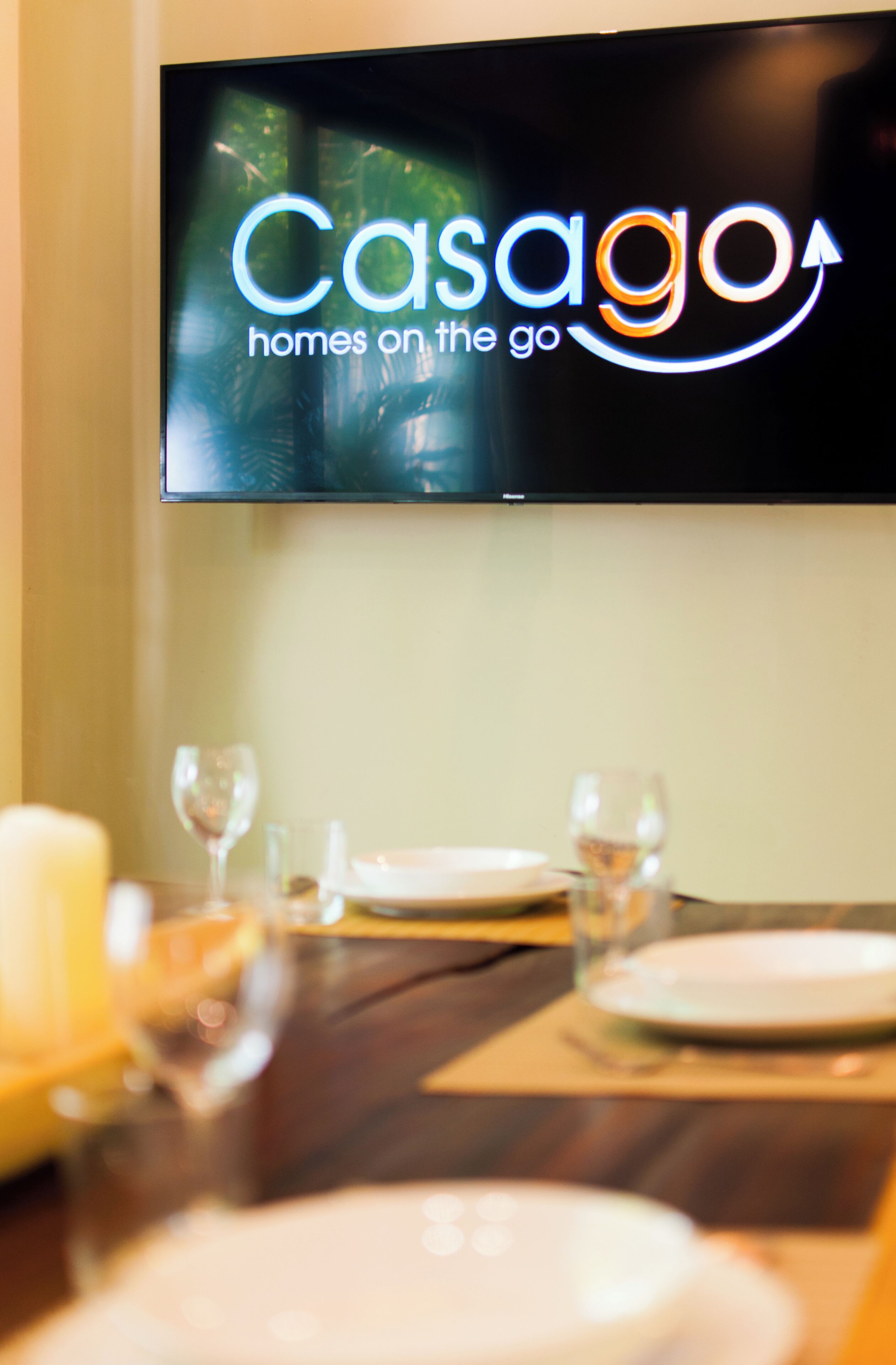 A television displaying the Casago logo with a tagline "homes on the go".
