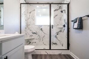 Shower, hair dryer, towels, soap
