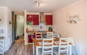 Fridge, stovetop, dishwasher, coffee/tea maker