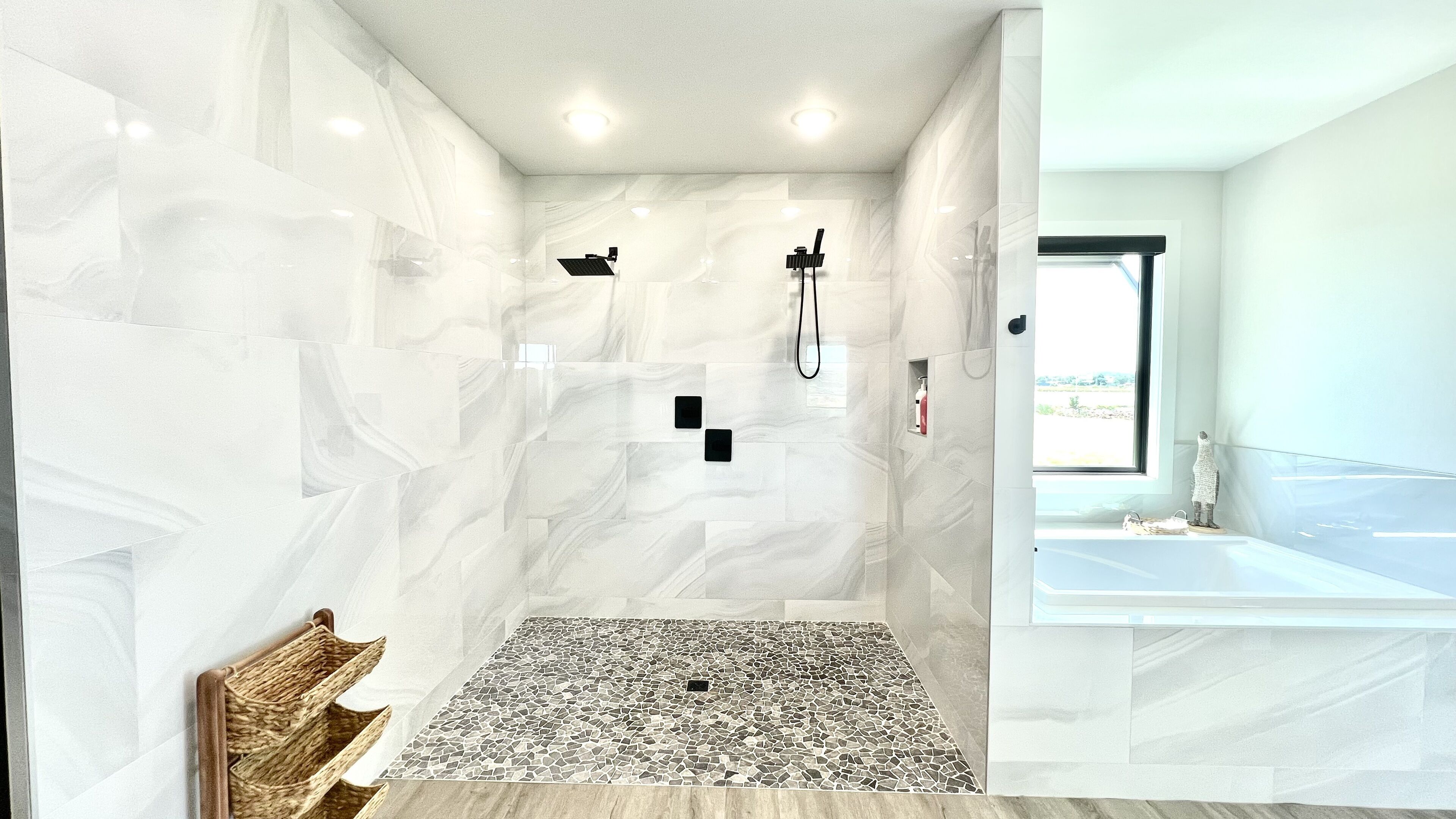 Primary en-suite bathroom shower and soaking tub