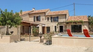 A two-story house with a swimming pool, a covered patio, and a garden with flowers. - Awesome home in Violes (Violes)