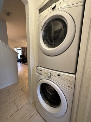 Compact washer and dryer unit for convenient laundry in a residential setting.
