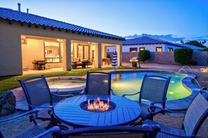 A patio with a fire pit, outdoor seating, and a swimming pool. - Luxury Resort Style Living w/ Pool & Jacuzzi (Indio)