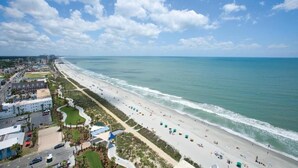 A coastal cityscape with a wide beach, a marina, and a mix of residential and commercial buildings. - Ocean Front 3 Bedroom, BAY VIEW Resort, 7th Floor, 12 Guests (Myrtle Beach)