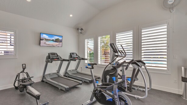 A gym with treadmills, an elliptical, and a stationary bike. - Freedom Village Retreat, Neighboring units, Near St George (Washington)