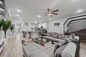 Smart TV, fireplace, books, stereo