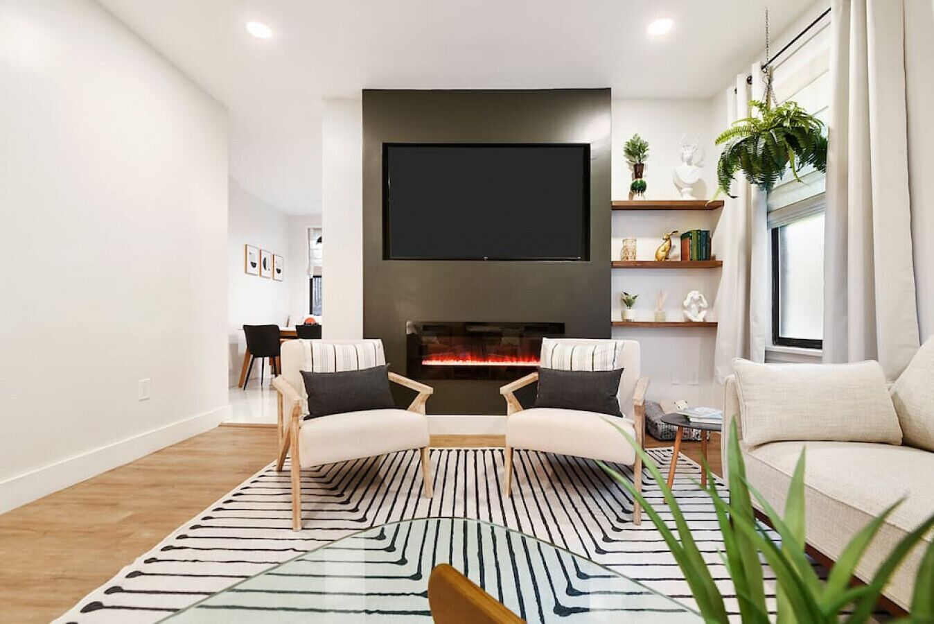 Smart TV, fireplace, books, stereo