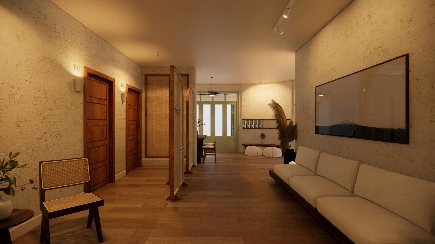 Un vaste espace de vie doté d’un plancher en bois, d’un canapé blanc, d’un fauteuil et d’un grand tableau encadré accroché au mur.
