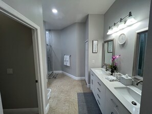 Shower, hair dryer, towels, soap