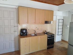 Fridge, oven, coffee/tea maker, dining tables