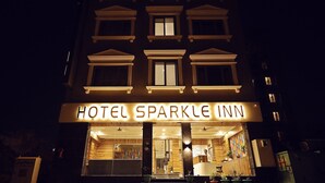 The exterior of Hotel Sparkle Inn at night with illuminated signage. - Hotel Sparkle Inn (Udaipur)