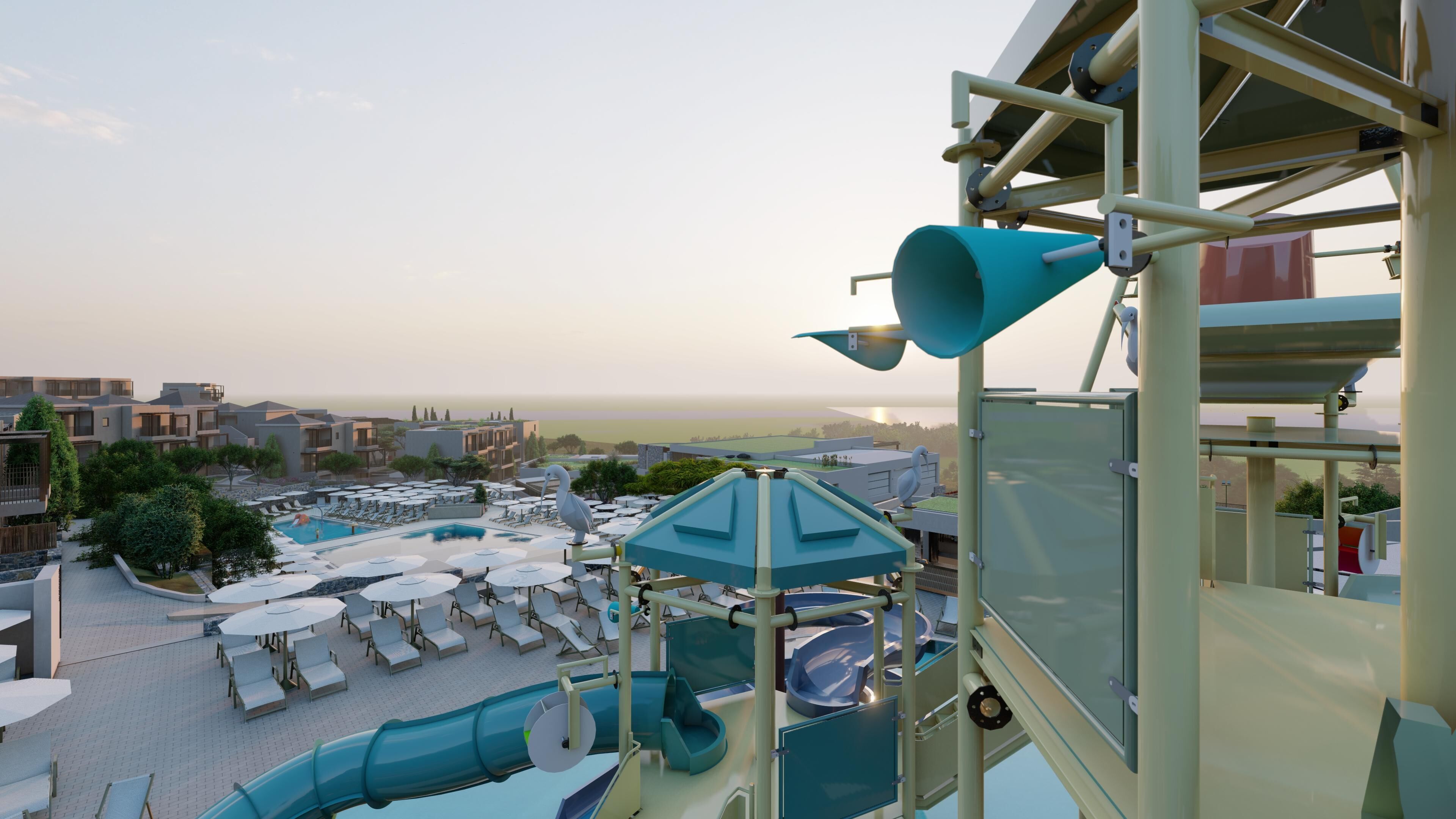 Um resort com área de piscina, toboáguas e vista para o mar.