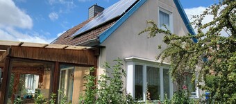 Vacation apartment with natural garden near the beach