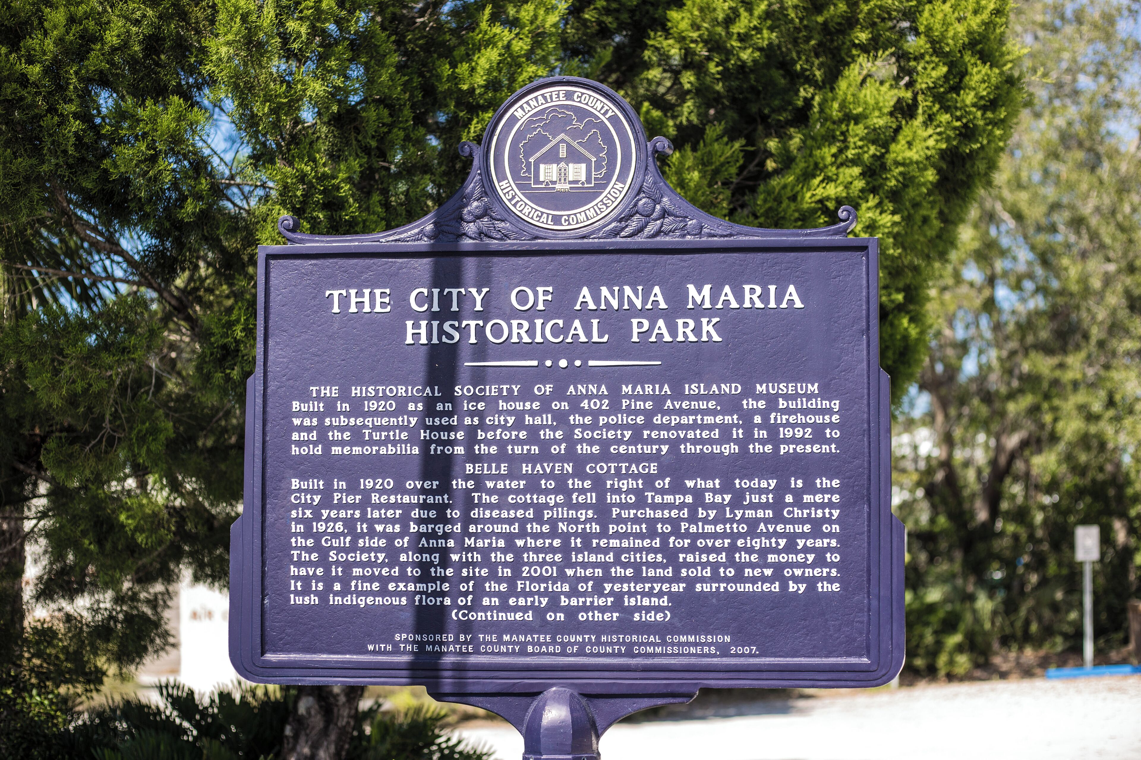 A historical marker sign for The City of Anna Maria Historical Park.
