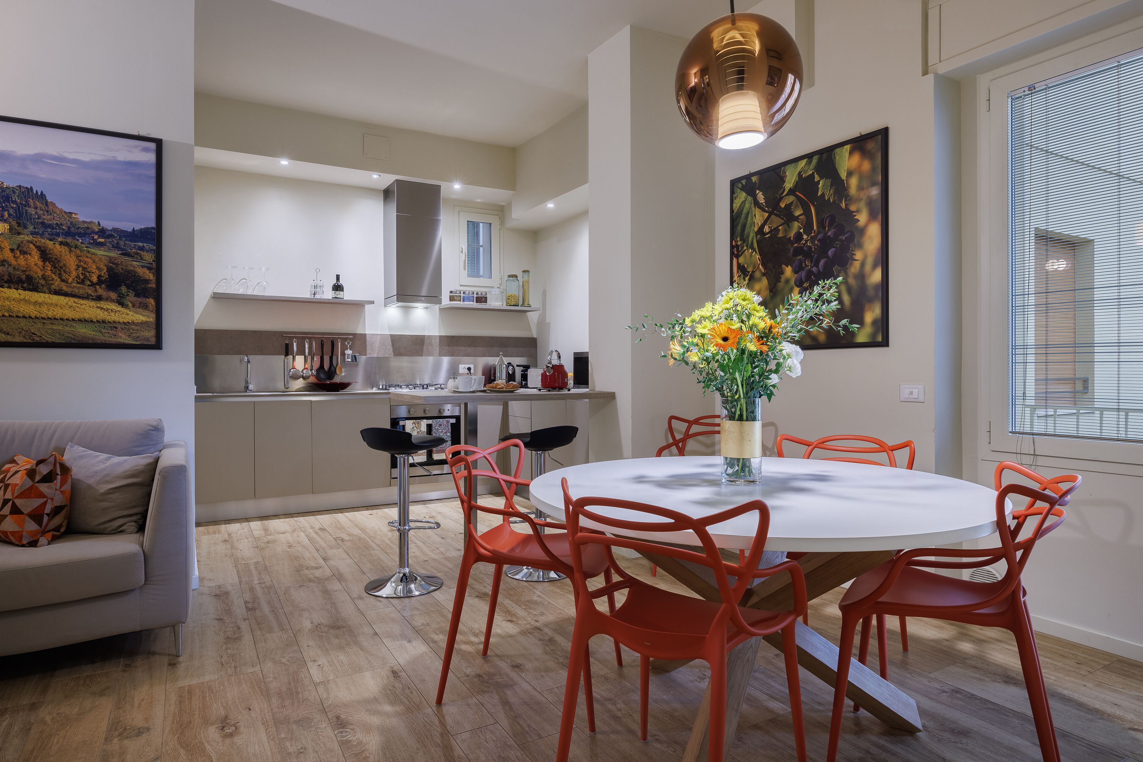 A modern kitchen with a dining area.