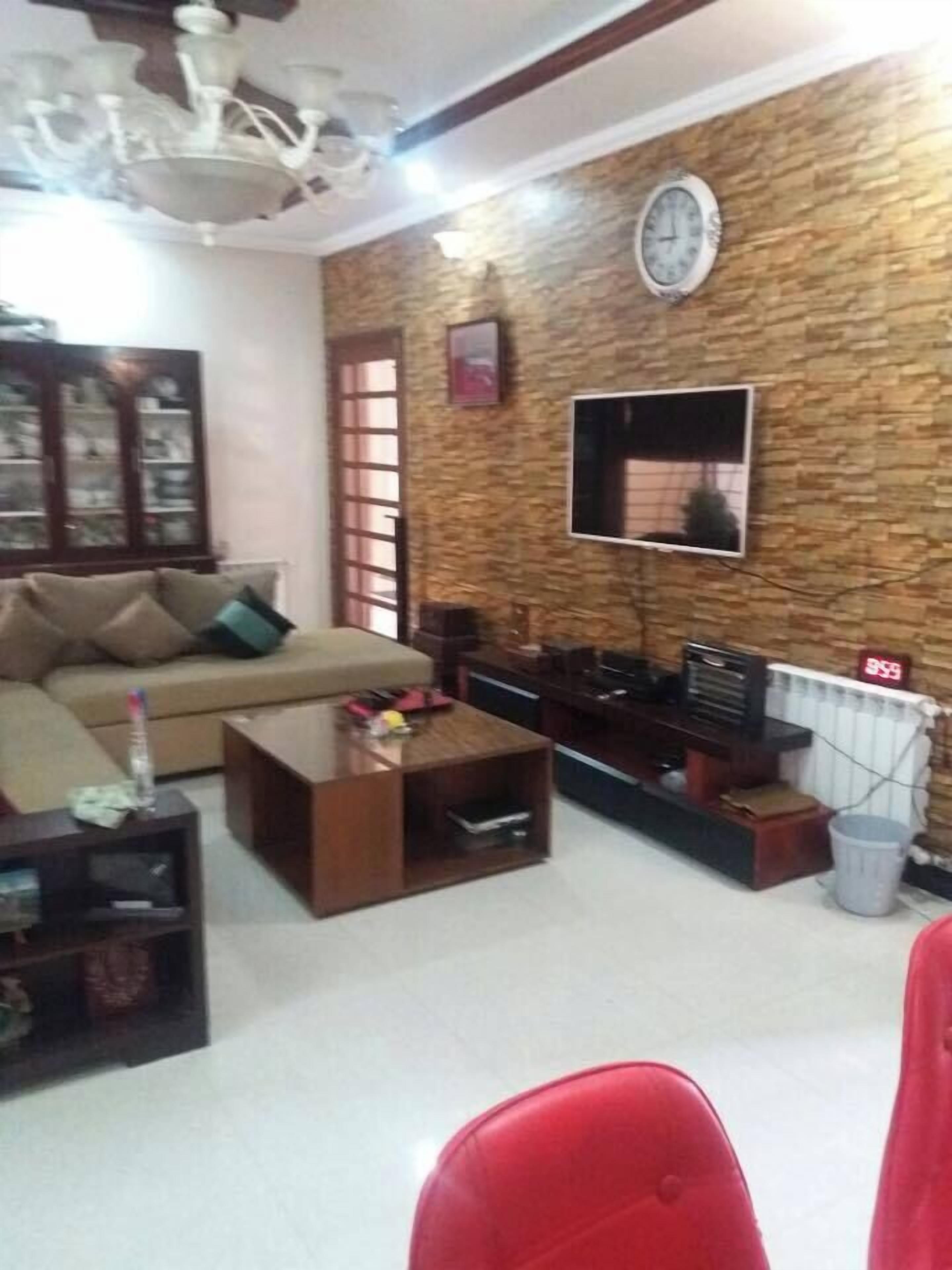 Deluxe Double Room | Living room | 32-inch LCD TV with cable channels