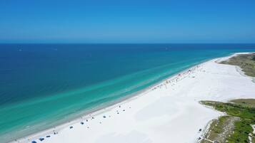 On the beach, sun loungers, beach towels