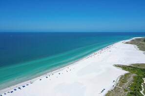On the beach, sun-loungers, beach towels
