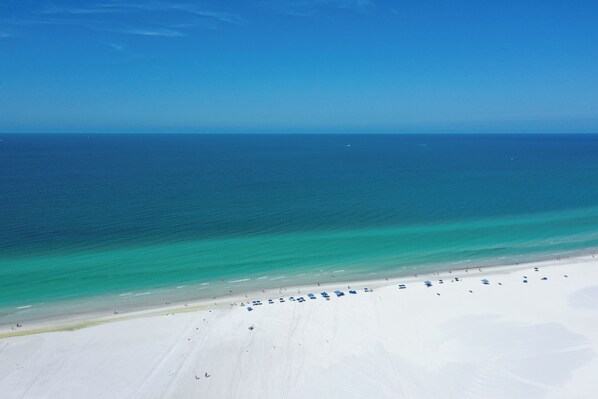 On the beach, sun-loungers, beach towels
