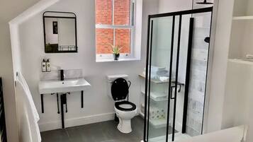 Shower, hair dryer, towels, soap