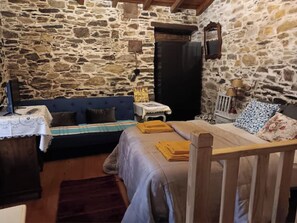 1 bedroom, desk, iron/ironing board, travel crib